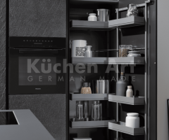Cuisine contemporaine avec îlot et facades en pierre naturelle au surfaces en bois Noyer sombre - 4